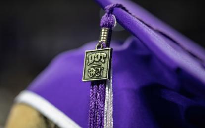 Commencement mortarboard cap with TCU 150 charm on tassel